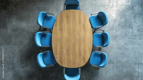 Top view of a contemporary meeting table surrounded by blue chairs, set against a concrete background, highlighting a modern and clean design for professional settings. photo