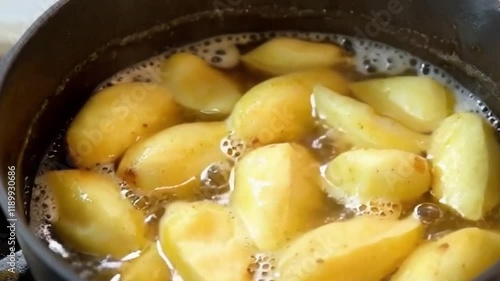 Steam rises golden potatoes bounce