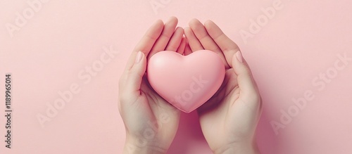 Wallpaper Mural Hands Gently Holding a Pink Heart: Symbol of Love, Care, and Compassion;  A Tender Gesture of Affection. Torontodigital.ca