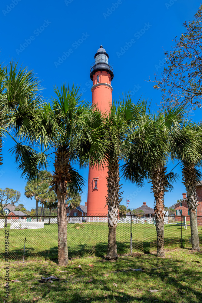 Beautiful view of the Ponce Inlet Lighthouse in sunny summer day in Daytona Beach, Florida.