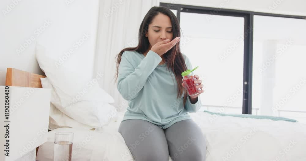 Sitting on bed, asian woman holding smoothie and relaxing in spa setting, at home Sitting on bed, asian woman holding smoothie and relaxing in spa setting, at home