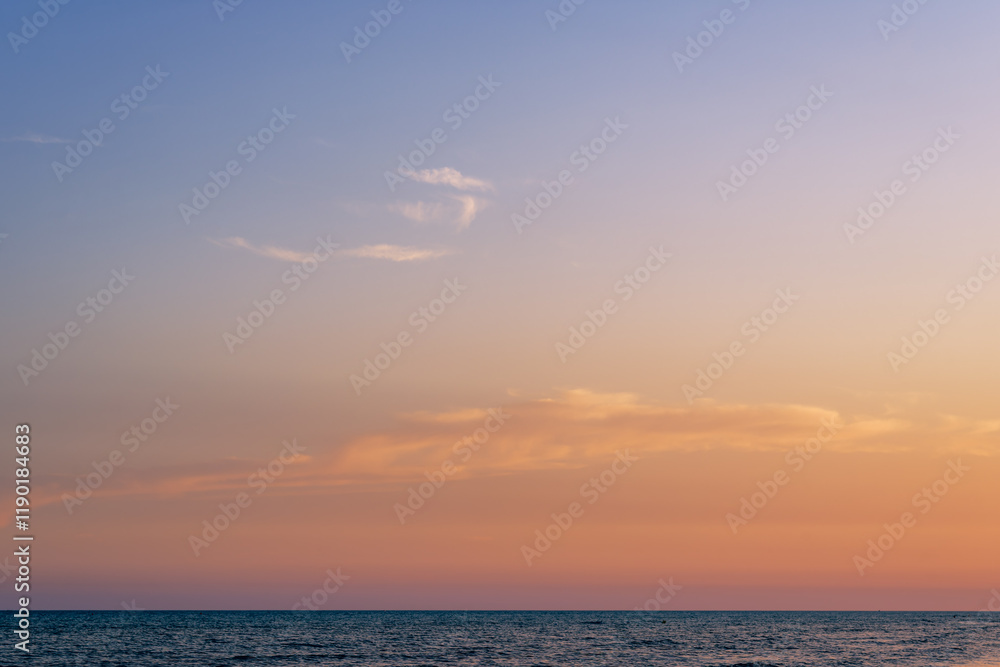 Fototapeta premium Tranquil Ocean and Gentle Sunset Glow