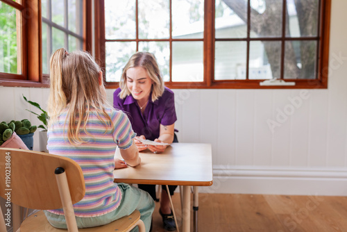 speech pathology clinician and child working together on talking