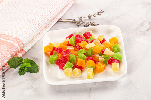 Sweet candied papaya colorful pieses photo