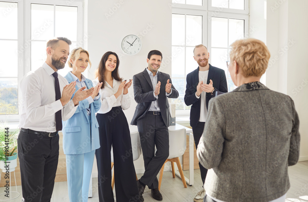 Engaged and diverse business people or colleagues team applauding during a work meeting or presentation in the office. Collaboration, presentation highlights, and discussions among colleagues. Engaged and diverse business people or colleagues team applauding during a work meeting or presentation in the office. Collaboration, presentation highlights, and discussions among colleagues.