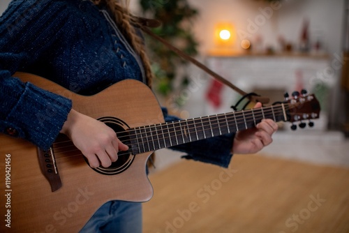 Guitar sessions by the warm fireplace bring joy and relaxation to all who attend photo