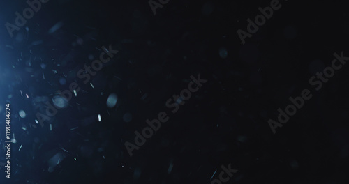 natural dust particles flow in air on black background