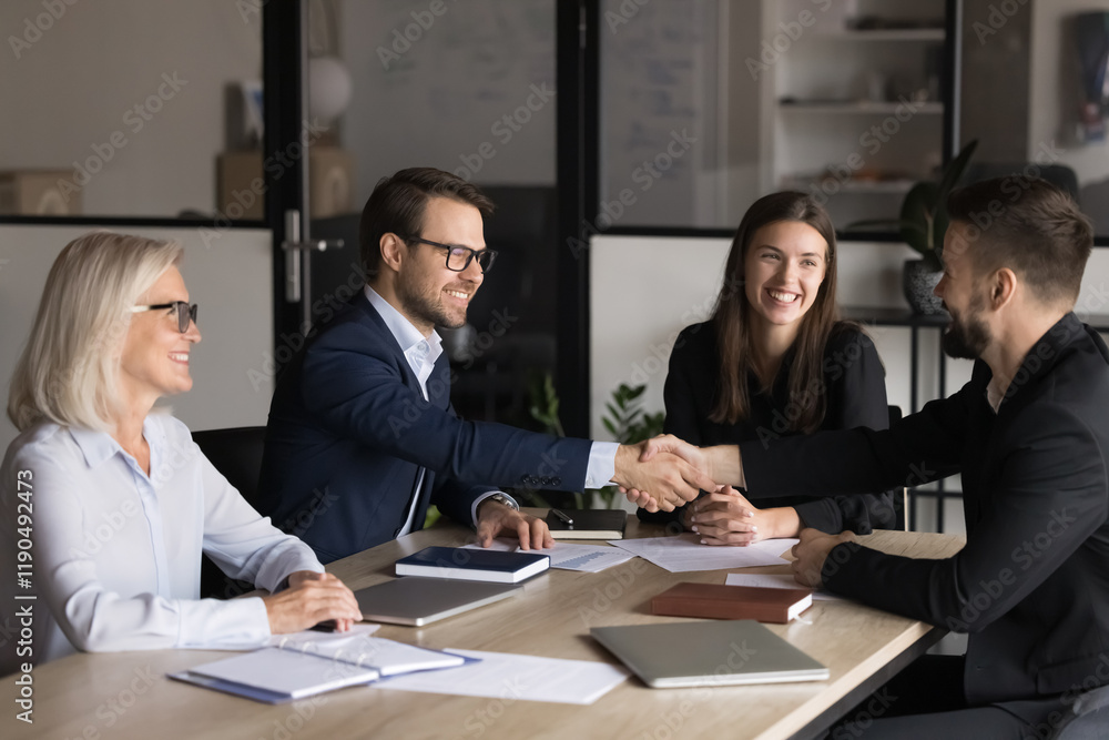 © fizkes - Two business parties shaking hands greeting each other start negotiations in board room, express mutual respect, thanking for cooperation, successful teamwork, establish partnership in company office © fizkes - Two business parties shaking hands greeting each other start negotiations in board room, express mutual respect, thanking for cooperation, successful teamwork, establish partnership in company office
