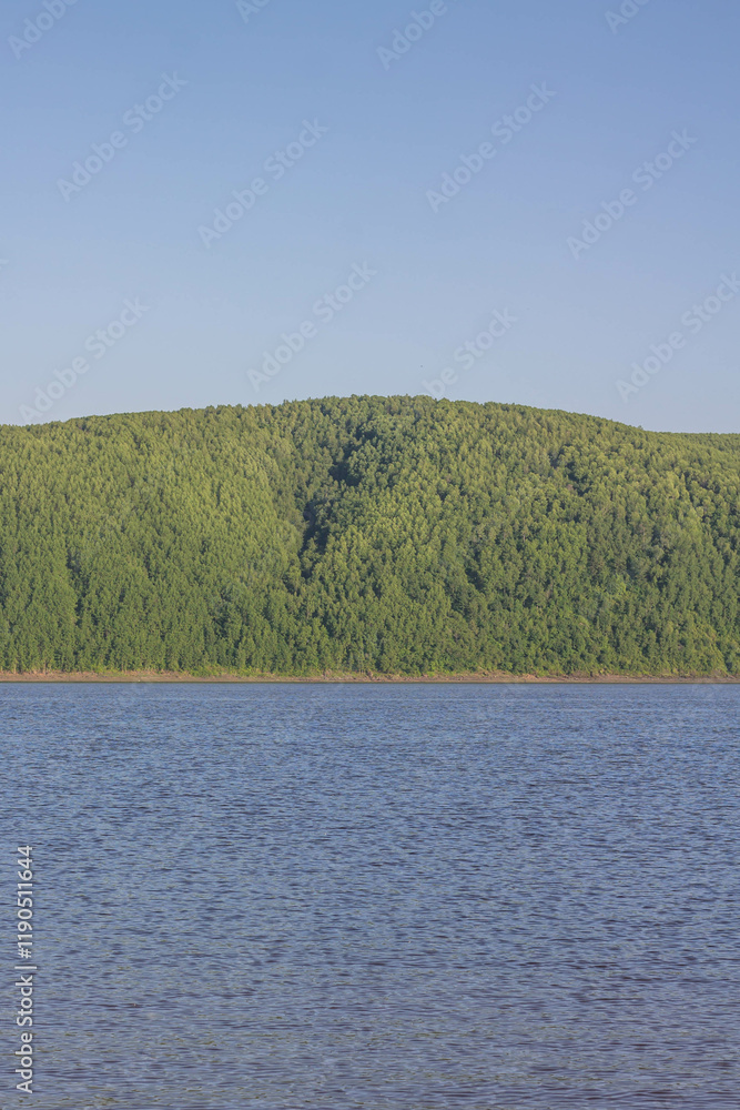 Landscape of the river and mountains on a background of blue sky Landscape of the river and mountains on a background of blue sky