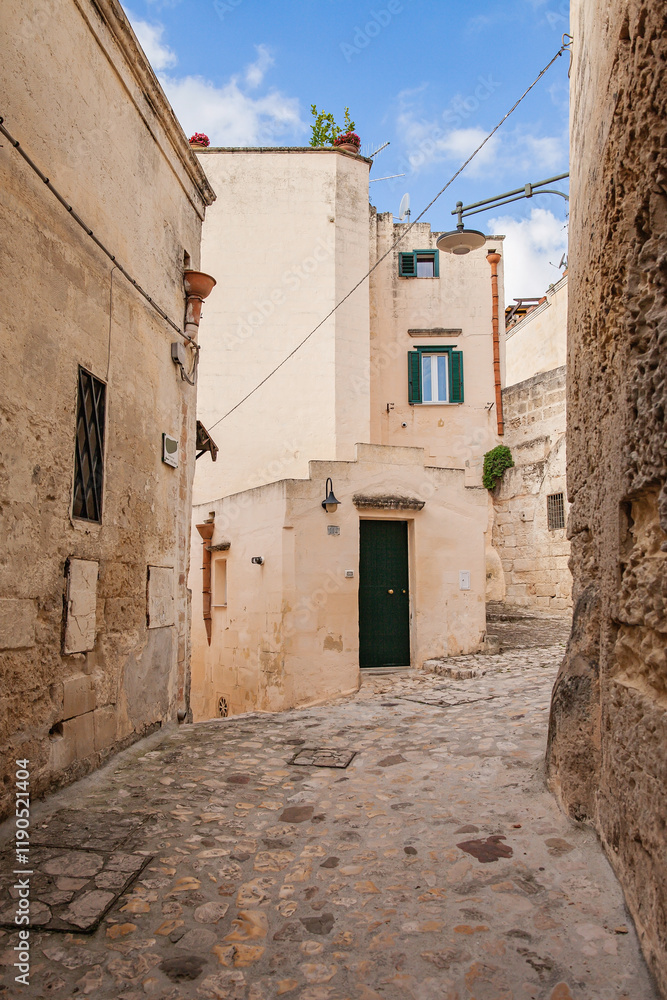 Fototapeta premium A street in the historical world heritage city of Matera, Puglia, Italy, la città dei sassi