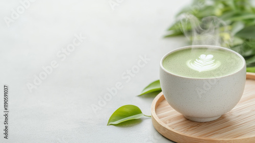 Wallpaper Mural steaming cup of matcha latte with latte art on wooden tray and green leaves Torontodigital.ca