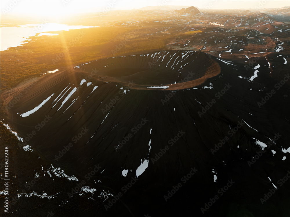 View from above, stunning aerial view of Hverfjall volcano at sunset. Hverfjall is a fascinating volcano near Lake Mývatn, with a crater approximately 1 km wide.