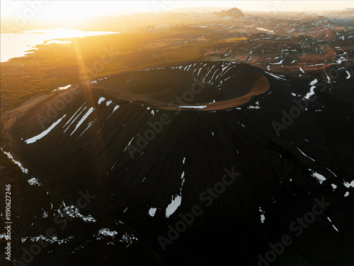 Obraz na płótnie View from above, stunning aerial view of Hverfjall volcano at sunset. Hverfjall is a fascinating volcano near Lake Mývatn, with a crater approximately 1 km wide. w salonie