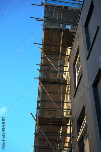 Building Under Construction with Metal and Wooden Scaffolding