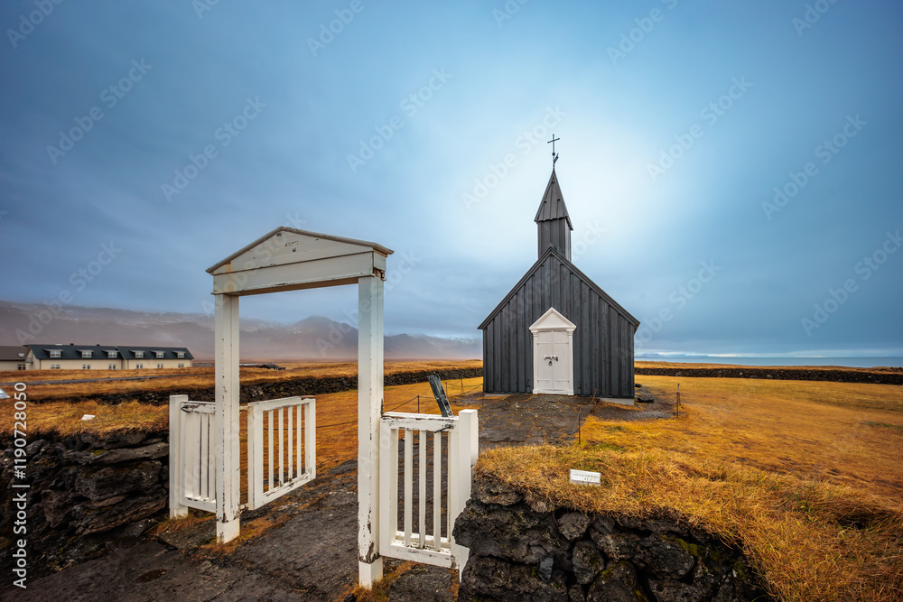 The traditional wooden church of Budakirkja in the autumn landscape in the west of Iceland