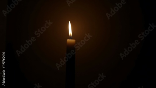 Burning candle in the dark