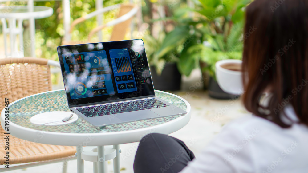 Businesswoman working uses a laptop and calculating on digital financial dashboard, planning business growth, strategy digital marketing, profit income, economy