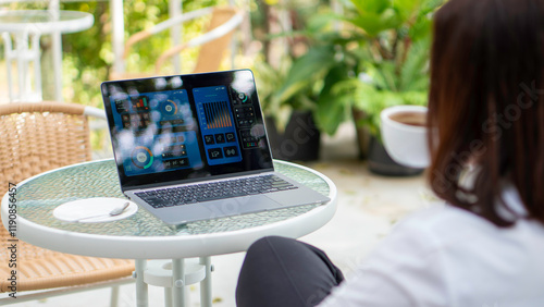 Obraz na płótnie Businesswoman working uses a laptop and calculating on digital financial dashboard, planning business growth, strategy digital marketing, profit income, economy w salonie