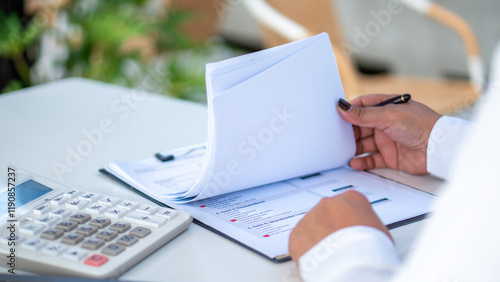 Obraz na płótnie businesswoman check company finances and earnings and budget. Business woman calculating expenses, managing budget, papers, loan documents, invoices. count taxes rental tenancy sum to pay online. w salonie