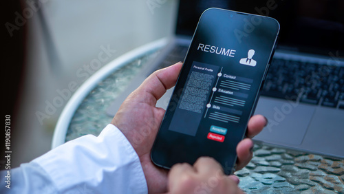 Obraz na płótnie A businessman using a smartphone with digital resume icons and a checkmark, symbolizing recruitment, digital hiring processes, and professional evaluation. w salonie