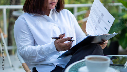 Obraz na płótnie Business woman calculating expenses, managing budget, papers, loan documents, invoices. count taxes rental tenancy sum to pay online. businesswoman check company finances and earnings and budget. w salonie