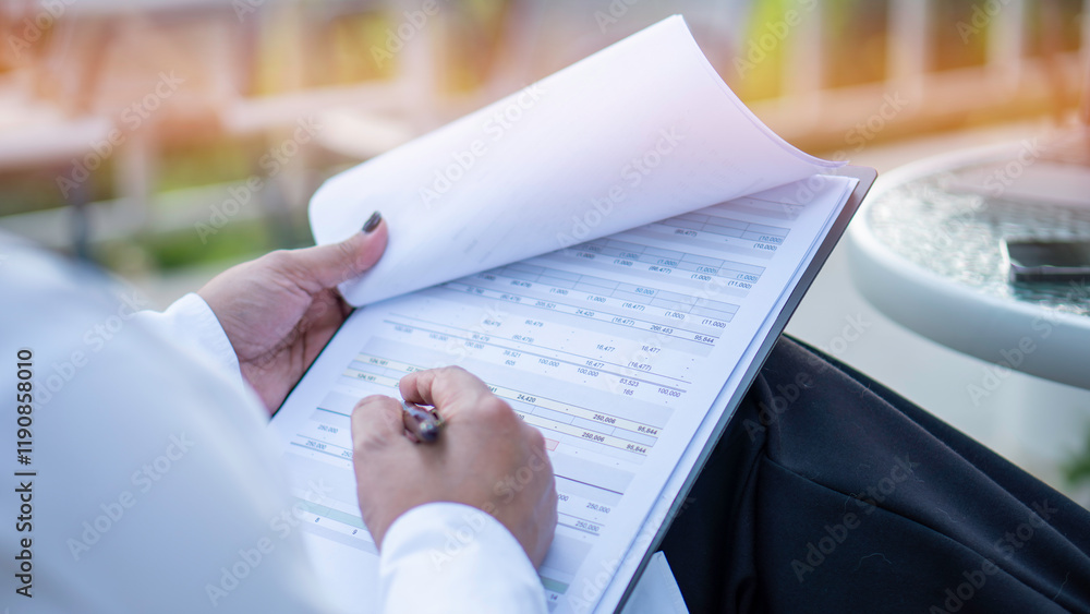 Business woman calculating expenses, managing budget, papers, loan documents, invoices. count taxes rental tenancy sum to pay online. businesswoman check company finances and earnings and budget.