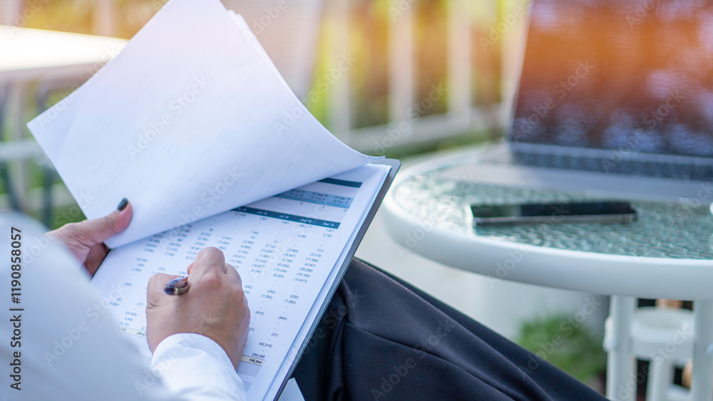 Business woman calculating expenses, managing budget, papers, loan documents, invoices. count taxes rental tenancy sum to pay online. businesswoman check company finances and earnings and budget.