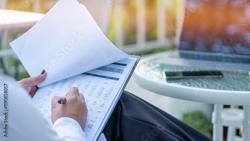 Obraz na płótnie Business woman calculating expenses, managing budget, papers, loan documents, invoices. count taxes rental tenancy sum to pay online. businesswoman check company finances and earnings and budget. w salonie