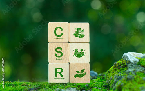 Fotografía Corporate Social Responsibility (CSR) with green CSR icon on wooden block