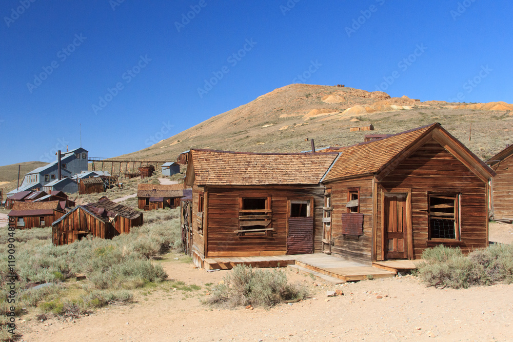 A small house sits in the middle of a desert A small house sits in the middle of a desert