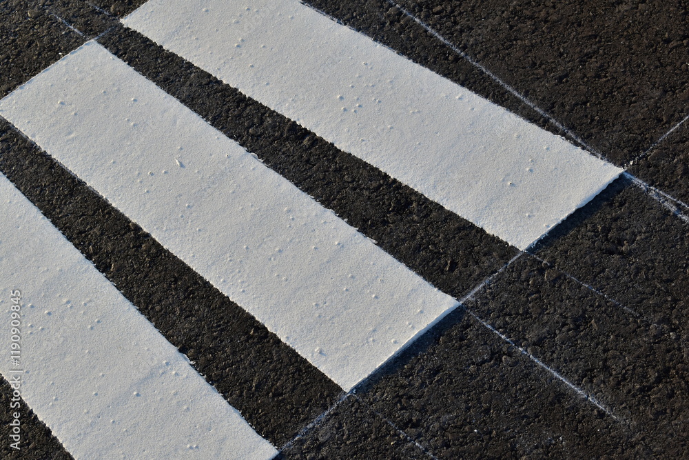 Fototapeta premium Newly painted road markings and draft lines on the road