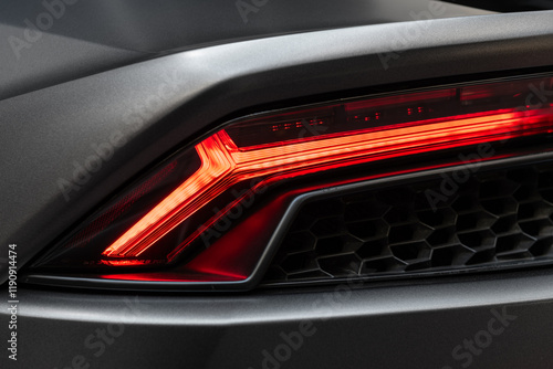 Red rear lights of modern sports car