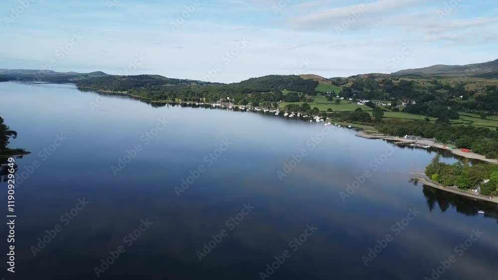 Drone shot of Lake Coniston, Lake District England, glass-like reflection of the stunning summer sky Drone shot of Lake Coniston, Lake District England, glass-like reflection of the stunning summer sky