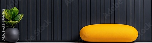 Minimalist Interior Design: A vibrant yellow beanbag chair adds a pop of color against a sleek, black slatted wall, creating a minimalist yet inviting atmosphere. photo