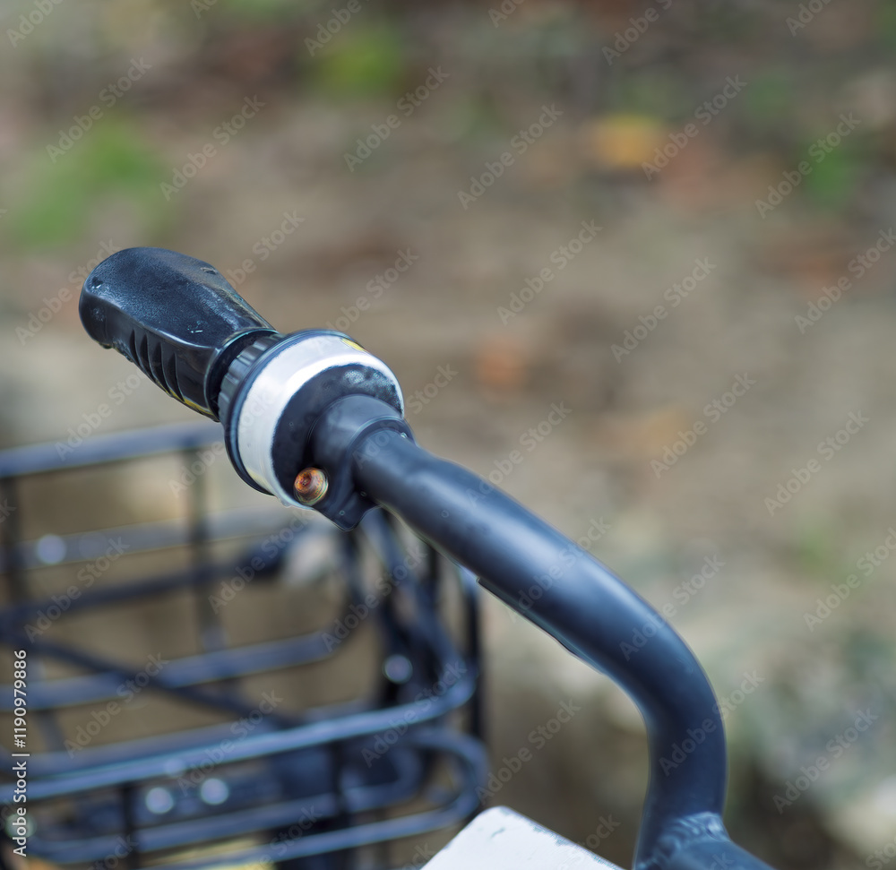 Close up Old rusly metal bell on the handlebar of an old Bicycle outside on the street background Close up Old rusly metal bell on the handlebar of an old Bicycle outside on the street background
