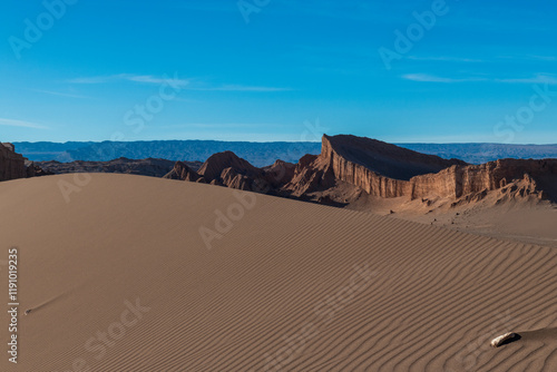 View of the amphitheater behind a sand dune