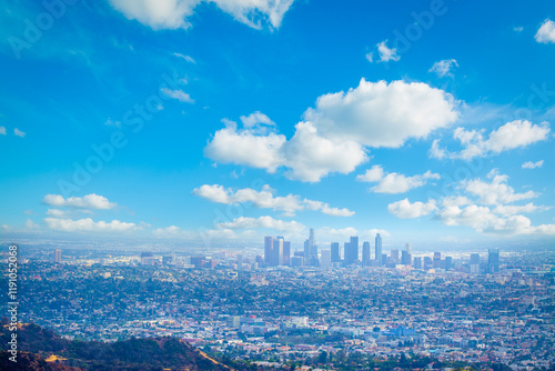 Obraz na płótnie Los Angeles skyline under a blue sky with clouds w salonie