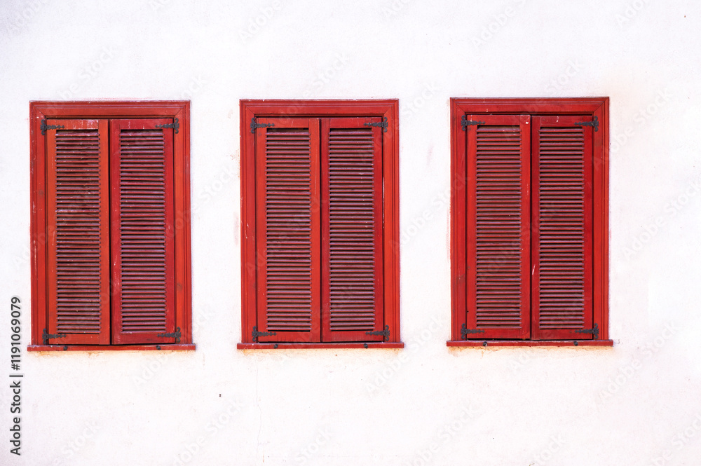 Antique traditional red window wood frame on white wall background