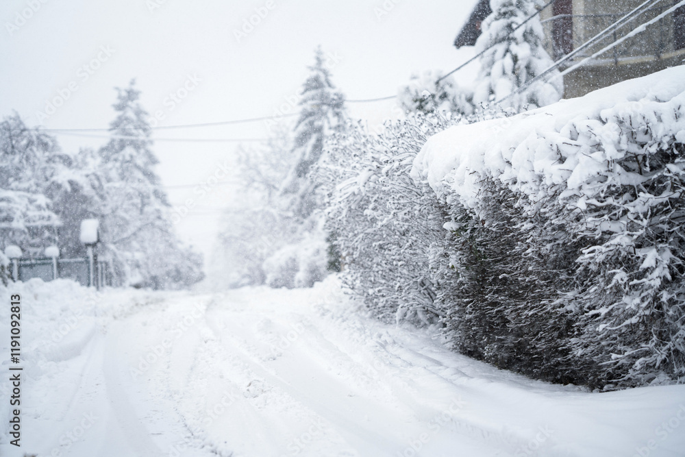 Obraz premium Snow covered winter road during snowstorm