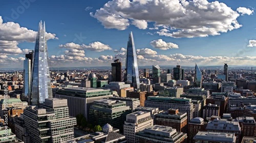 Stunning aerial view of London skyline featuring modern architecture and dynamic cloud formations
