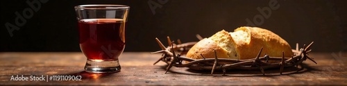 A symbolic representation of communion with bread and wine on a rustic wooden table. photo