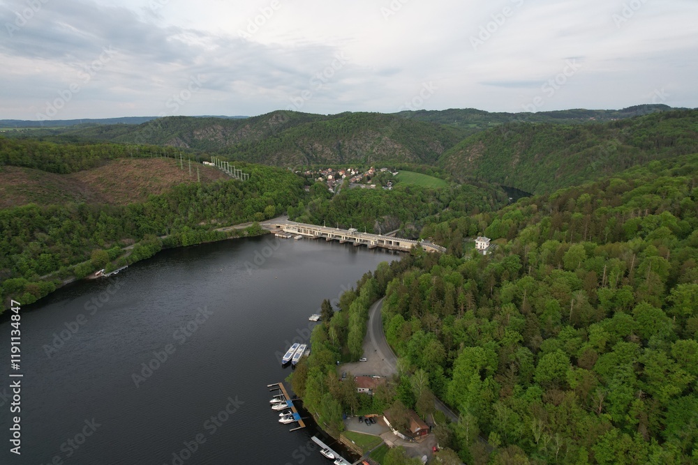 Obraz premium Slapy Reservoir is dam on the Vltava river in the Czech Republic, near to village Slapy. It has a hydroeletrics power station included.Aerial panorama landscape photo 
