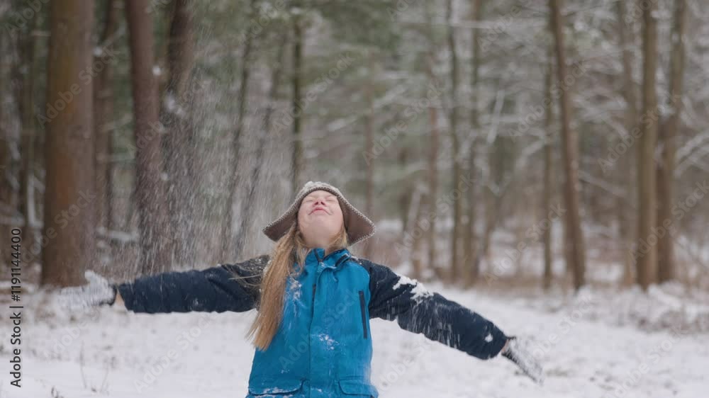 Portrait of gen alpha girl playing with snow on the forest path .winter. slow motion Portrait of gen alpha girl playing with snow on the forest path .winter. slow motion
