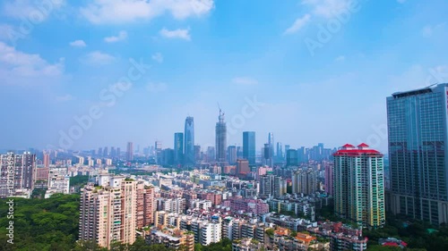 Stunning view of Tianhe District skyline in Guangzhou City during a clear day photo