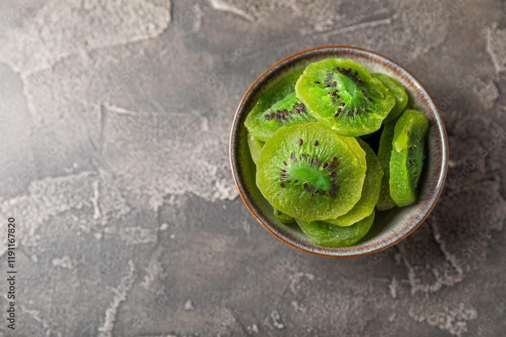 Kiwi dried fruit on wooden background. kiwi candied fruit. Healthy food. Ingredient for baking cupcakes. Healthy snack, vegetarian sweets. Space for text. Copy space Kiwi dried fruit on wooden background. kiwi candied fruit. Healthy food. Ingredient for baking cupcakes. Healthy snack, vegetarian sweets. Space for text. Copy space