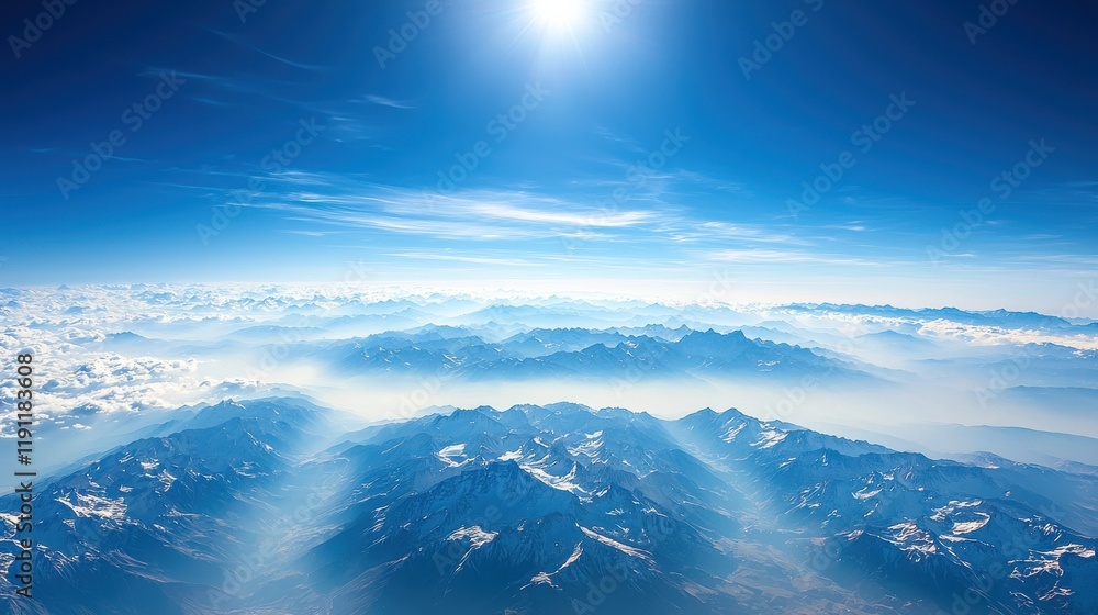 Aerial view of breathtaking mountain peaks above clouds high altitude nature landscape stunning blue sky serene environment Aerial view of breathtaking mountain peaks above clouds high altitude nature landscape stunning blue sky serene environment