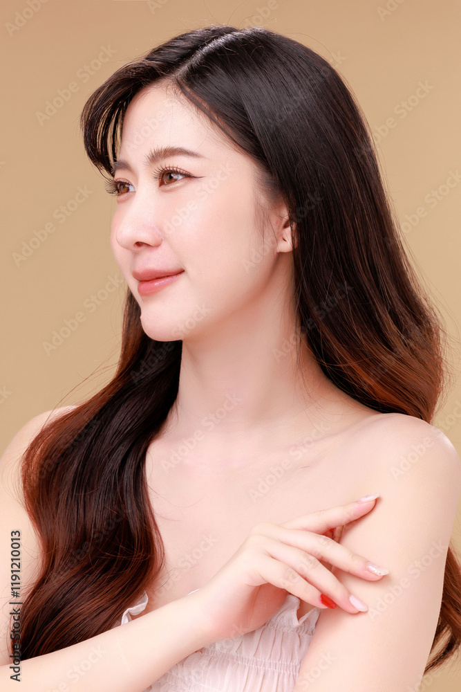 Fototapeta premium Beauty portraits of young Asian woman with clean fresh skin on beige background. Cute female model, beauty blogger make up artist in studio. Skincare, plastic surgery, spa concept.