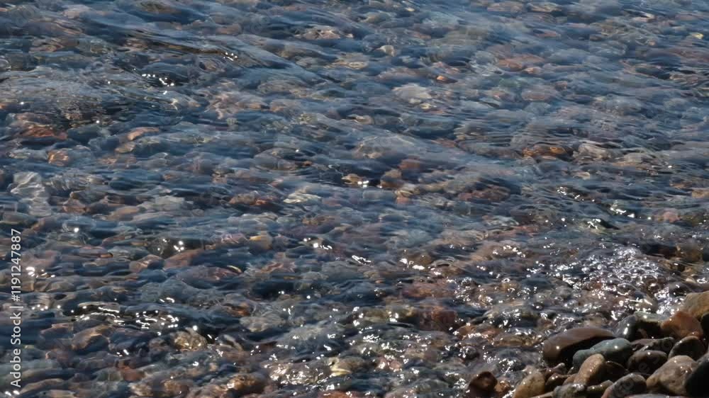 Waves calmly washing up rocky sea beach. Seashore. Calm, Meditation, travel Waves calmly washing up rocky sea beach. Seashore. Calm, Meditation, travel