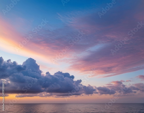 Dramatic sunset evening sky. Fluffy clouds, summer skies, cloudy background. Aerial nature sunrise over the tranquill sea photo