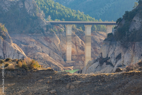 Lack water La Llosa Del Cavall Reservoir. The swamp is at very low water levels due to lack of rain. Desertification, climate change, environmental problems, drought. Lleida, Spain photo